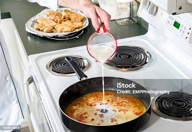 Lowfat Milk Added To Red Peppers And Chicken Broth Stock Photo - Download Image Now - Chef, Color Image, Cooking
