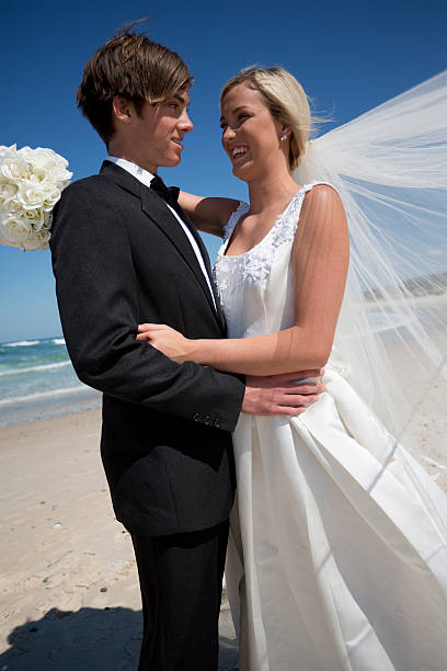 istock Newly Married Couple at the Beach 155442728