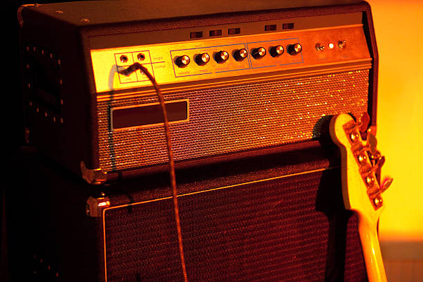 Bass Guitar Amplifier Bass Guitar Amplifier - high iso shot! acoustic guitar photos stock pictures, royalty-free photos & images