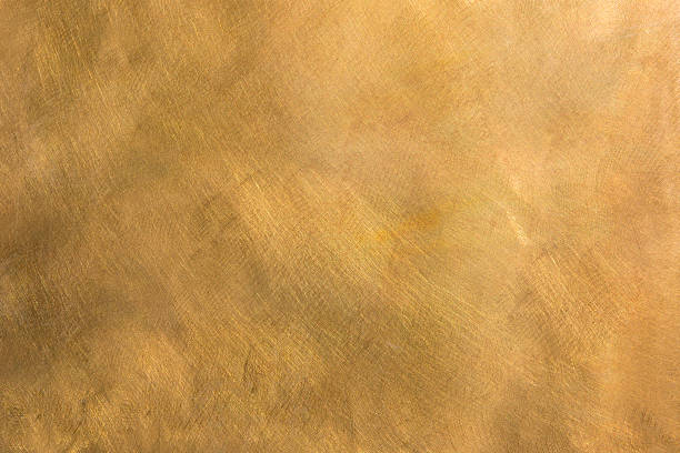 Abstract brass metal plate structured background XXL Brushed brown-golden copper or bronze surface, with visible brush strokes. The sheet metal has an appealing cloudy, wavy texture. Horizontal orientation. The image has been shot outdoors during natural day light, full frame and close up. Ideal for backgrounds. The dimensions of the photo are 5040 x 3360 px. High resolution. classic metal stock pictures, royalty-free photos & images