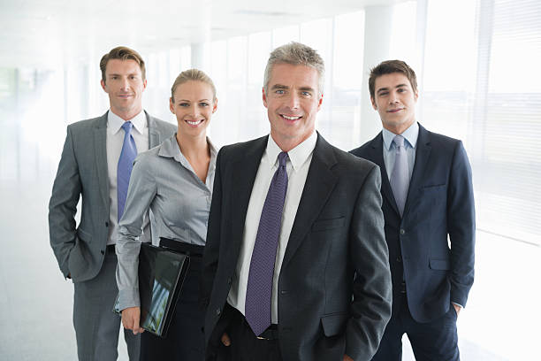 istock Write the title... Four people in business dress. 155443507
