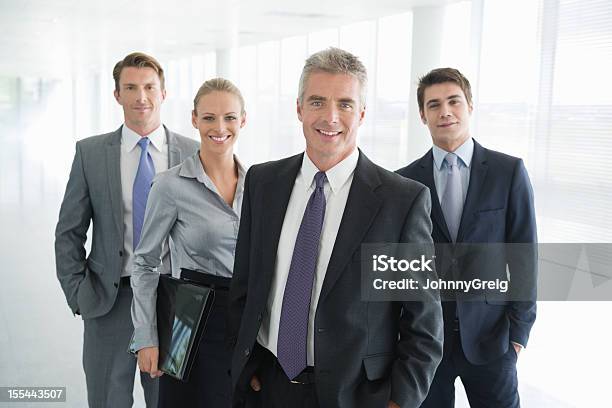 Write The Title Four People In Business Dress Stock Photo - Download Image Now - 20-24 Years, 20-29 Years, 25-29 Years