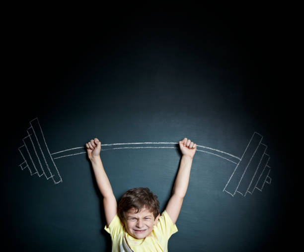 istock Little boy weight lifter 155443694