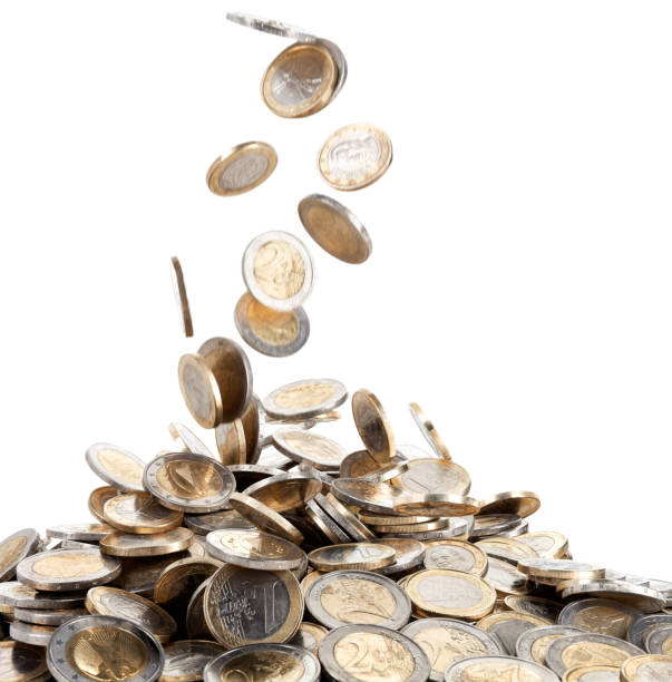 Falling Motion of Euro Coins Onto a Mound of Money Concept of a stream on Euro coins falling to create a large "fortune" at the bottom of the image. Isolated on white background. Canon 5D MarkII pennies from heaven stock pictures, royalty-free photos & images