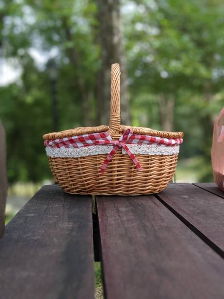 istock wooden table and basket for picnic concept 1554437952