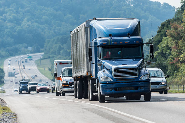istock Blue Semi-truck With Other Traffic On Interstate Highway 155444019