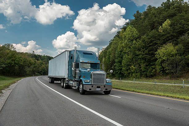 istock Lone Blue Semi-Truck On Interstate Highway 155444279