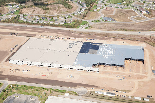 istock Large Commercial Warehouse Construction Site Aerial 155444790