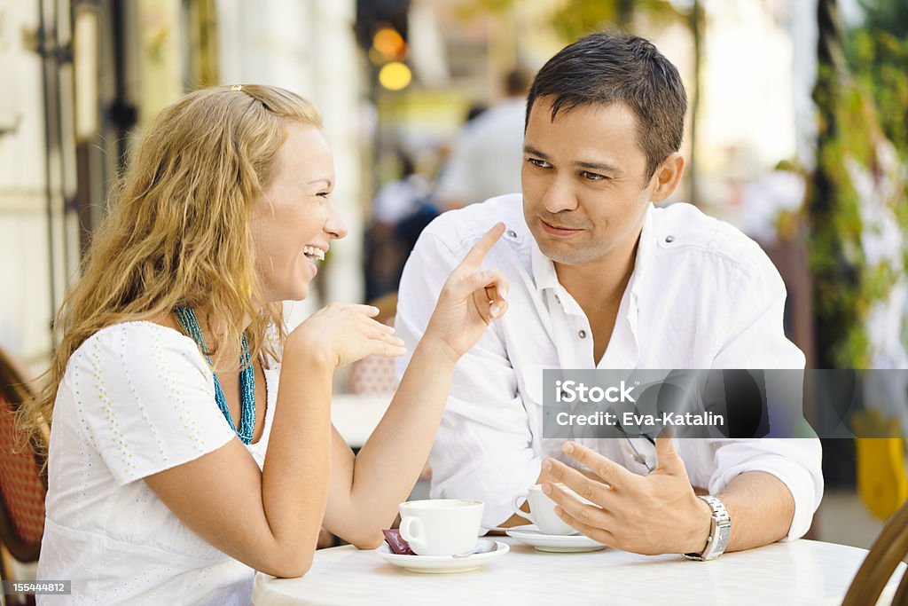 Happy couple having a coffee break Happy couple enjoying a cup of cappuccino 20-24 Years Stock Photo