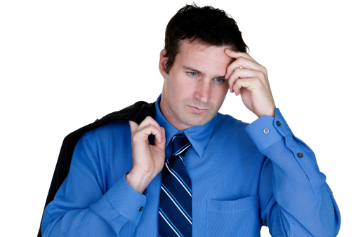 Businessman wearing a suit and looking stressed out 