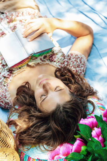 istock Girl Sleeping in the Shade 155445891