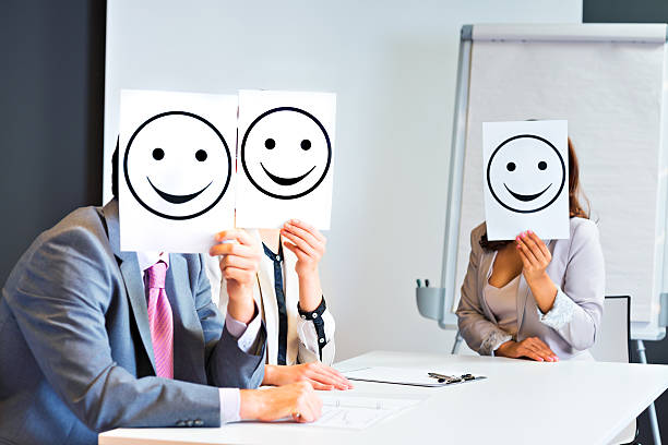 istock Business team holding happy smile sign 155445902