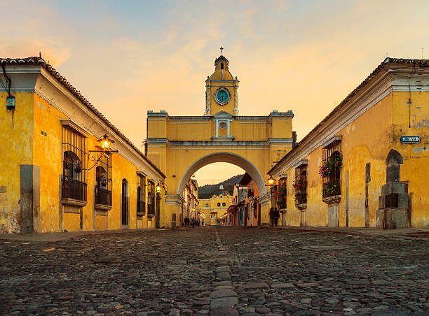 santa catalina arch in antigua downtown low camera position for shot of the Arch of Santa Catalina in Antigua, Guatemala - one of the icons of this town. guatemala stock pictures, royalty-free photos & images