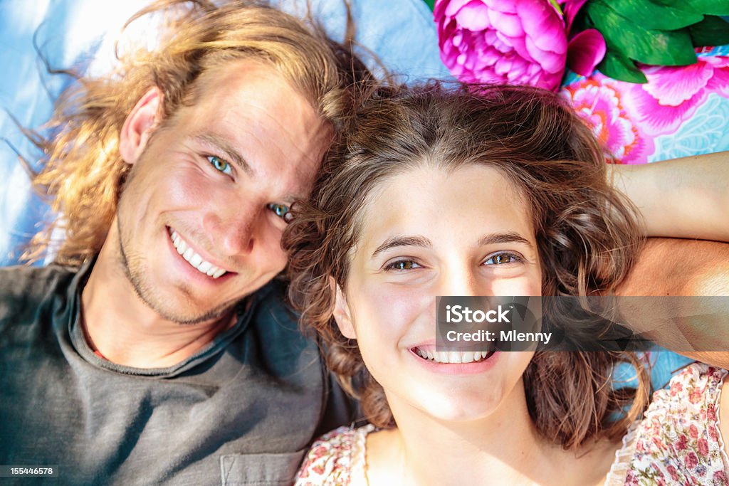 Couple Relaxing on Blanket in the Grass  Adult Stock Photo
