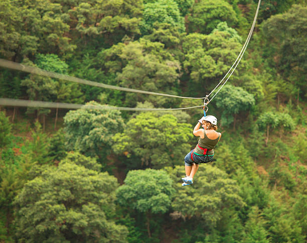 woman during a Canopy Tour in Guatemala  zip line stock pictures, royalty-free photos & images