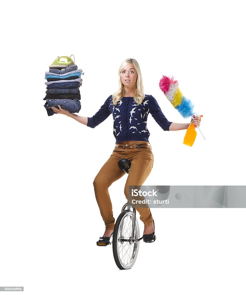 multi tasking overload young woman looks fed up with her workload Unicycle Stock Photo