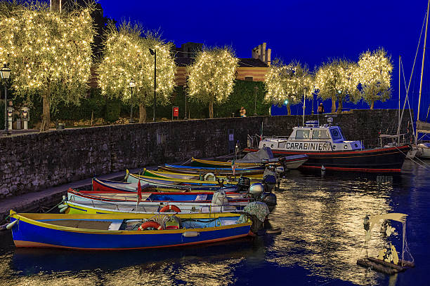 A row of fishing boats is moored in the harbor of Torri del Benaco, where a small crib floats on water. The tiny town, decorated for the Christmas season, is a tourist spot of extraordinary charm, with its pretty houses painted in pastel colours and flowered balconies. It is located on the Veronese shore of Lake Garda, the largest Italian lake.[url=/file_search.php?action=file&lightboxID=9060030/?refnun=argalis#11a3941][img]http://dl.dropbox.com/u/55784374/Let's-Christmas!.jpg[/img][/url][url=/file_search.php?action=file&lightboxID=8314950/?refnun=argalis#1c94b801][img]http://dl.dropbox.com/u/55784374/Lago-di-Garda.jpg[/img][/url][url=/file_search.php?action=file&lightboxID=8197624/?refnun=argalis#a0b7ce6][img]http://dl.dropbox.com/u/55784374/Verona's-Countryside.jpg[/img][/url]