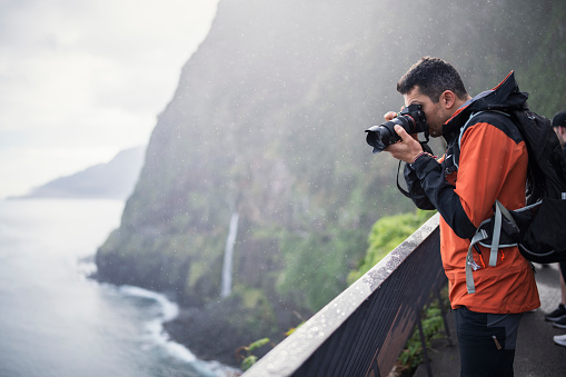 Photographer taking a picture of the beautiful landscape in Madeira,Portugal.