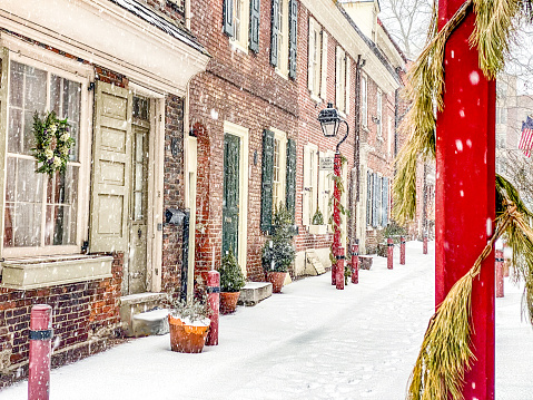 Center city Philadelphia. Elfreth's Alley street in the winter, covered with white snow.