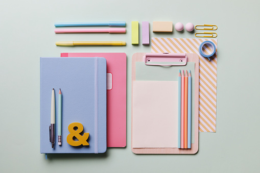 Office desk working space flat lay with colorful supplies