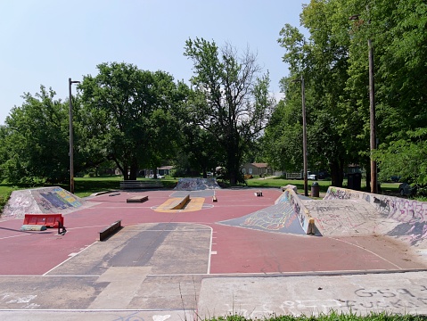 Photos of skate park ramps and jumps used primarily for skateboarding and other extreme sports. This skate park is located in the Pacific Northwest in the mountains which can be seen in the background.