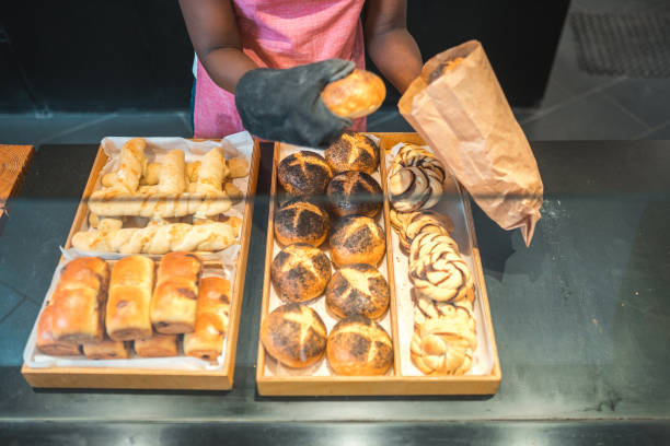 Close-up photo of freshly baked bread and bagels on a self-service food counter in the hotel's restaurant buffet area