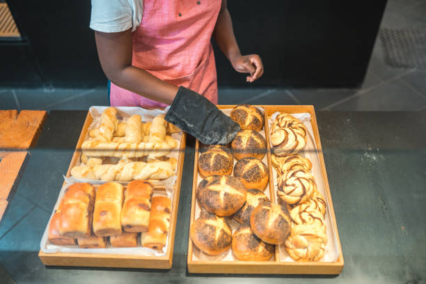 Lovely Black Female Preparing Order In An Artisan Bakery