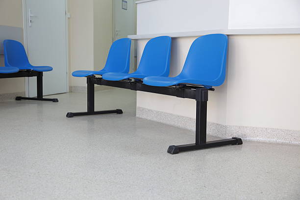 istock waiting room blue chairs on the floor 155456604