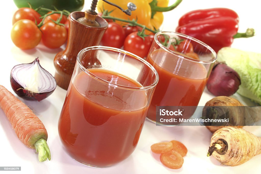 Healthy smoothie made with assorted root vegetables fresh vegetable juice with peppers, carrots and other fresh vegetables Carrot Stock Photo