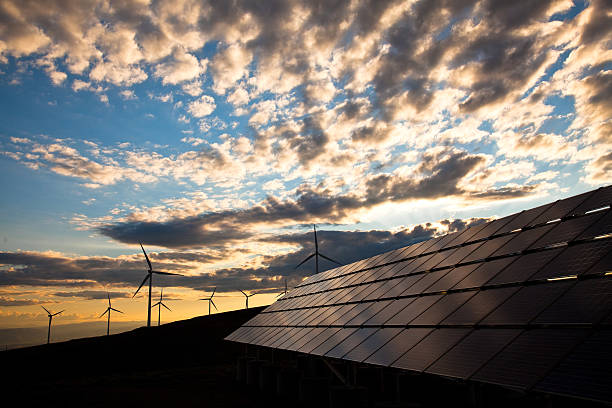 istock solar panels and wind turbines at sunset 155458353