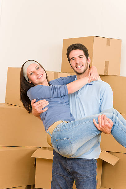 istock Moving new home young man holding woman 155460173