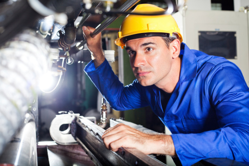 modern machine operator working in factory