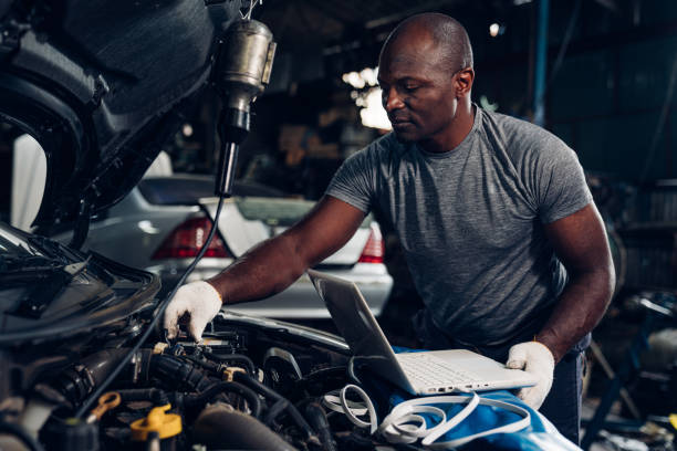 istock Auto mechanic are repair mechanical part and maintenance auto engine is problems at car repair shop. 1554616775