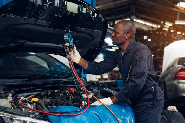 Auto mechanic are repair mechanical part and maintenance auto engine is problems at car repair shop. stock photo