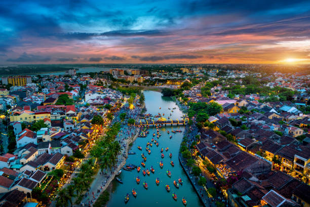 istock Hoi An ancient town and Hoai river in twilight, Vietnam. 1554625713