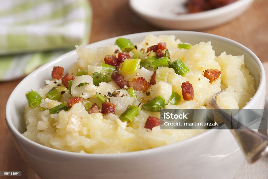 Mashed potatoes Mashed potatoes with leeks and crispy bacon in a bowl Mashed Potatoes Stock Photo