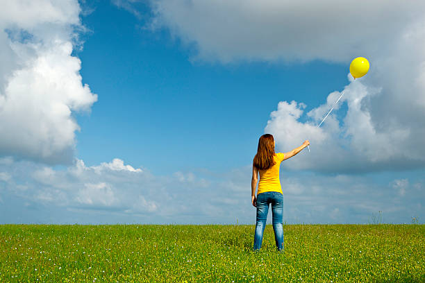 istock Girl with a balloon 155464127