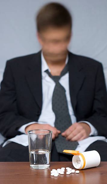 istock Pills and glass of water 155464132