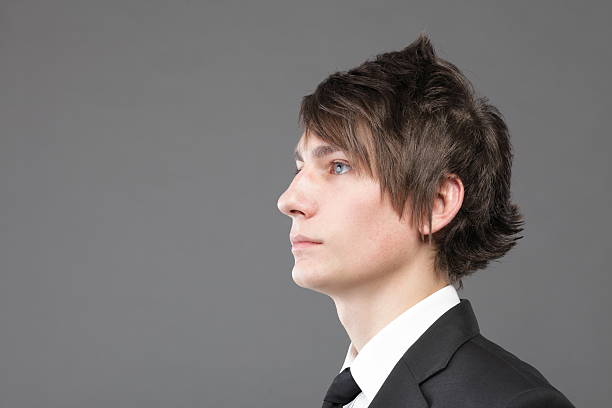 istock young businessman black suit casual tie on gray background 155465080