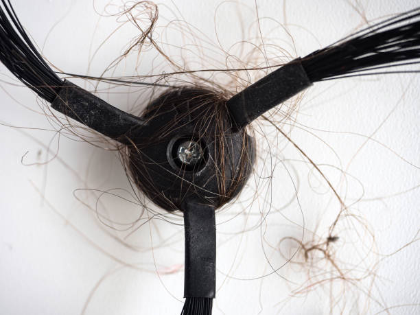 istock robot vacuum cleaner brush clogged with hair and dust 1554652807