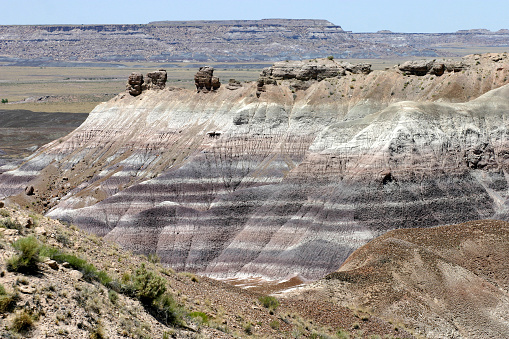 Ancient and colorfully striated geological rock layers and formations of the Painted Desert in Petrified Forest National Park, Arizona, USA