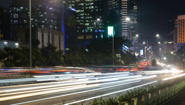istock Jakarta Night Traffic Light Trails – Slow Shutter Technique 1554663514
