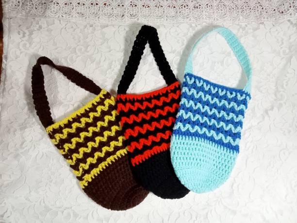 istock Crochet bag handmade multi-color background texture 1554694441