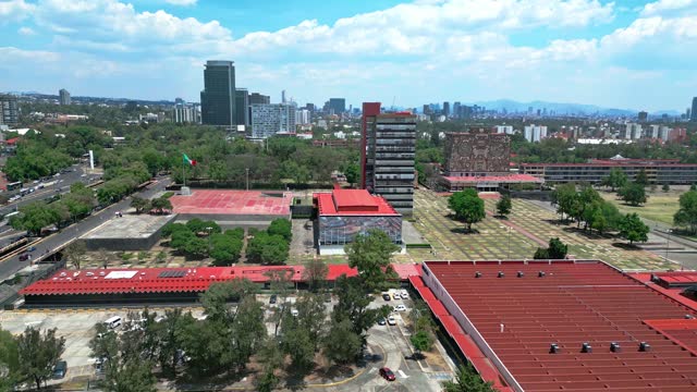 Aerial view of amazing and picturesque view of contemporary University City located in Mexico on sunny day under blue sky with clouds