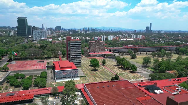 Aerial view of amazing and picturesque view of contemporary University City located in Mexico on sunny day under blue sky with clouds