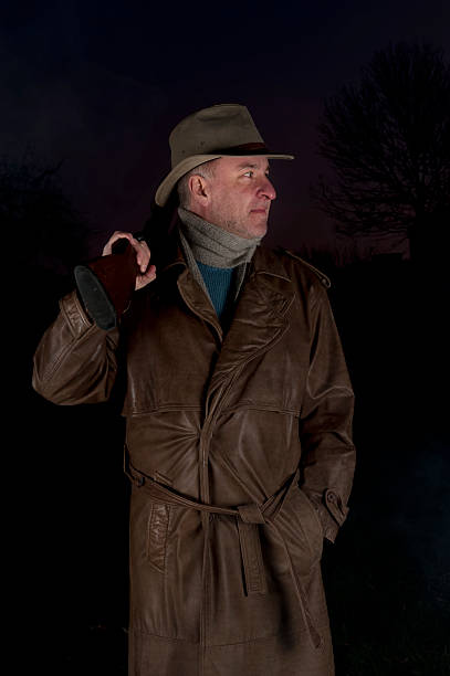 istock man with cowboy hat, long leather coat and riot gun 155472230