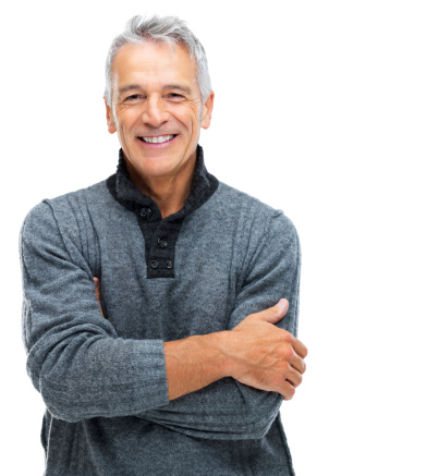 Portrait of a smiling senior man with arms crossed while isolated on a white background