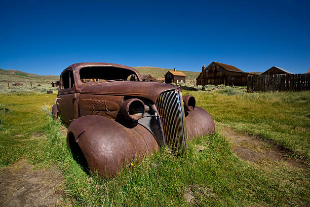 istock Rusty Old Car and Wooden Houses 155473260