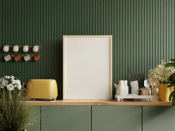 Photo of Mock up poster frame in kitchen interior and accessories with dark green wooden slatted wall background.