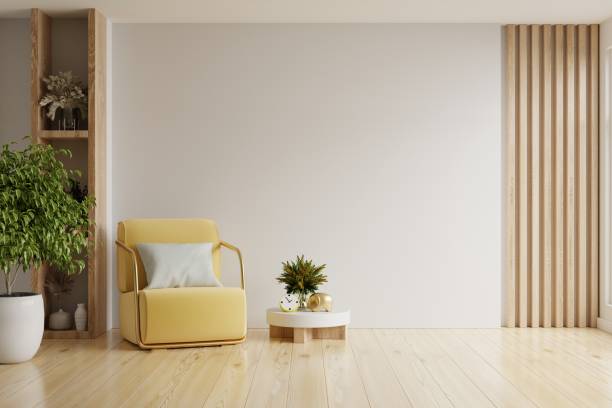 istock Modern minimalist interior with an yellow armchair on empty white wall background. 1554752544